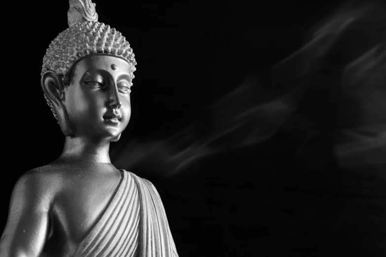 a buddha statue is shown in this black and white po