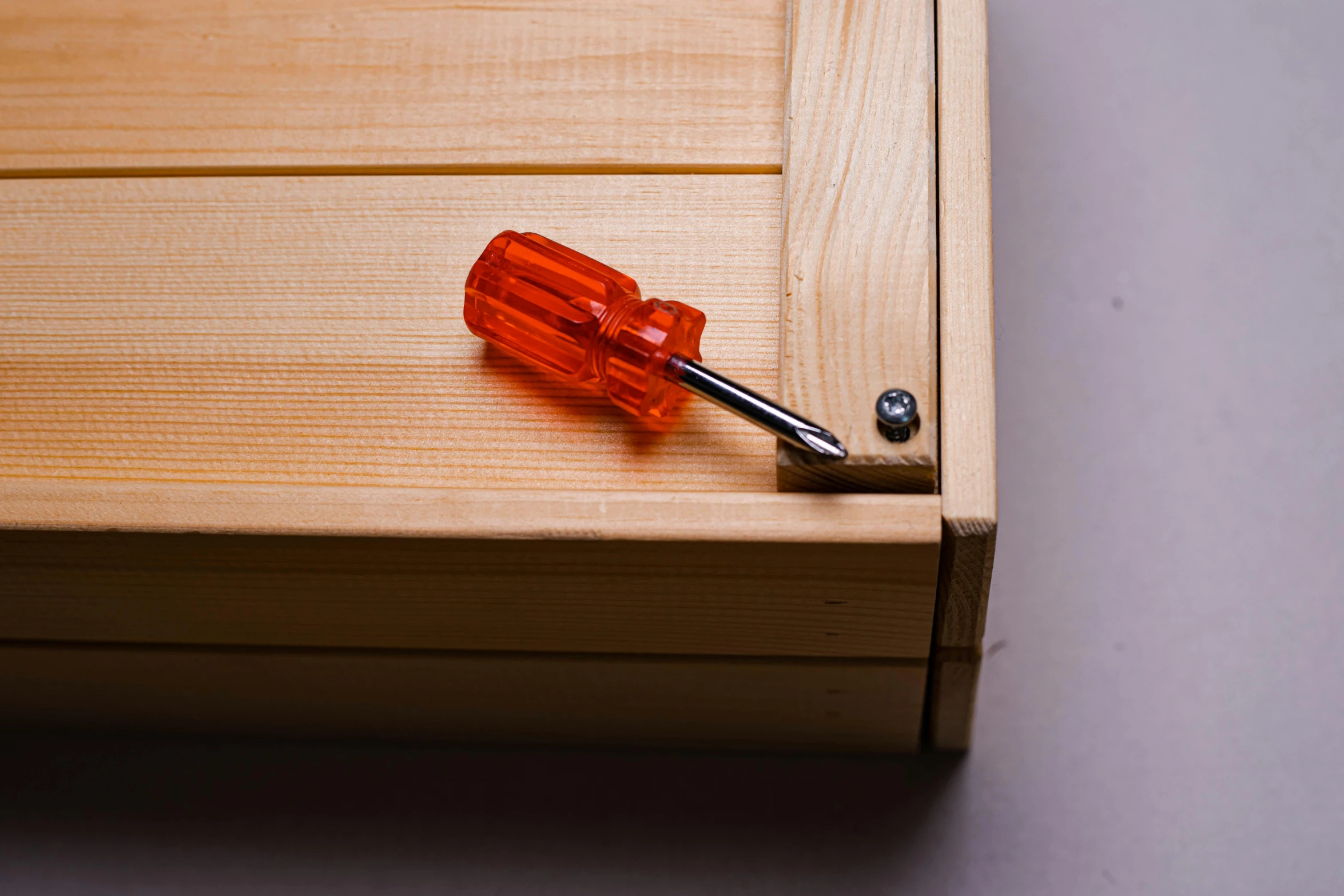 an open drawer with a key on top of it