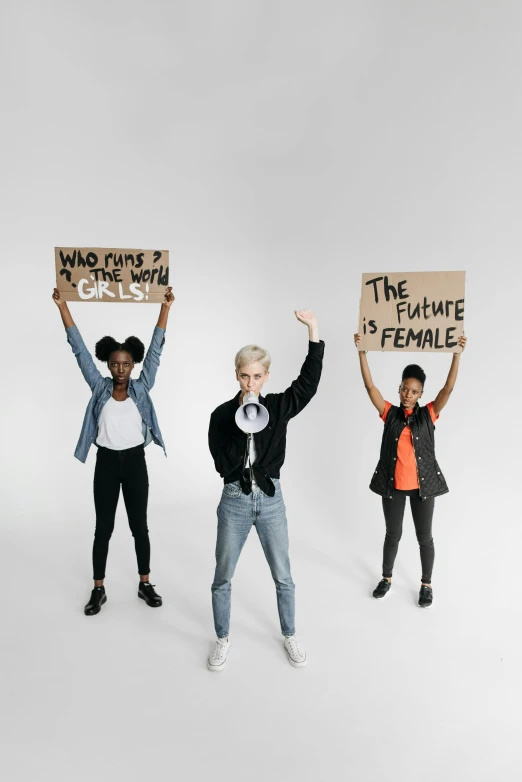 a group of people holding up signs with words