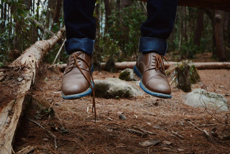 a person's feet standing on top of some nches