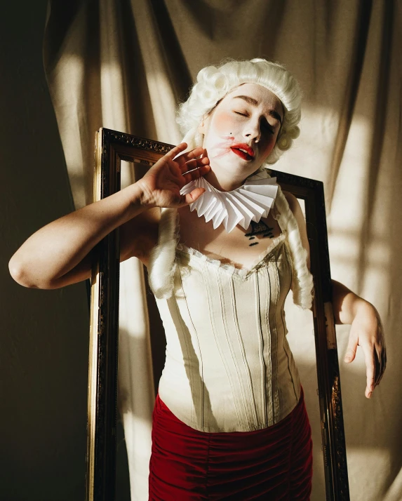 the woman is wearing red and white makeup and wearing a corset