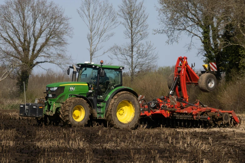 a tractor that is driving behind another vehicle