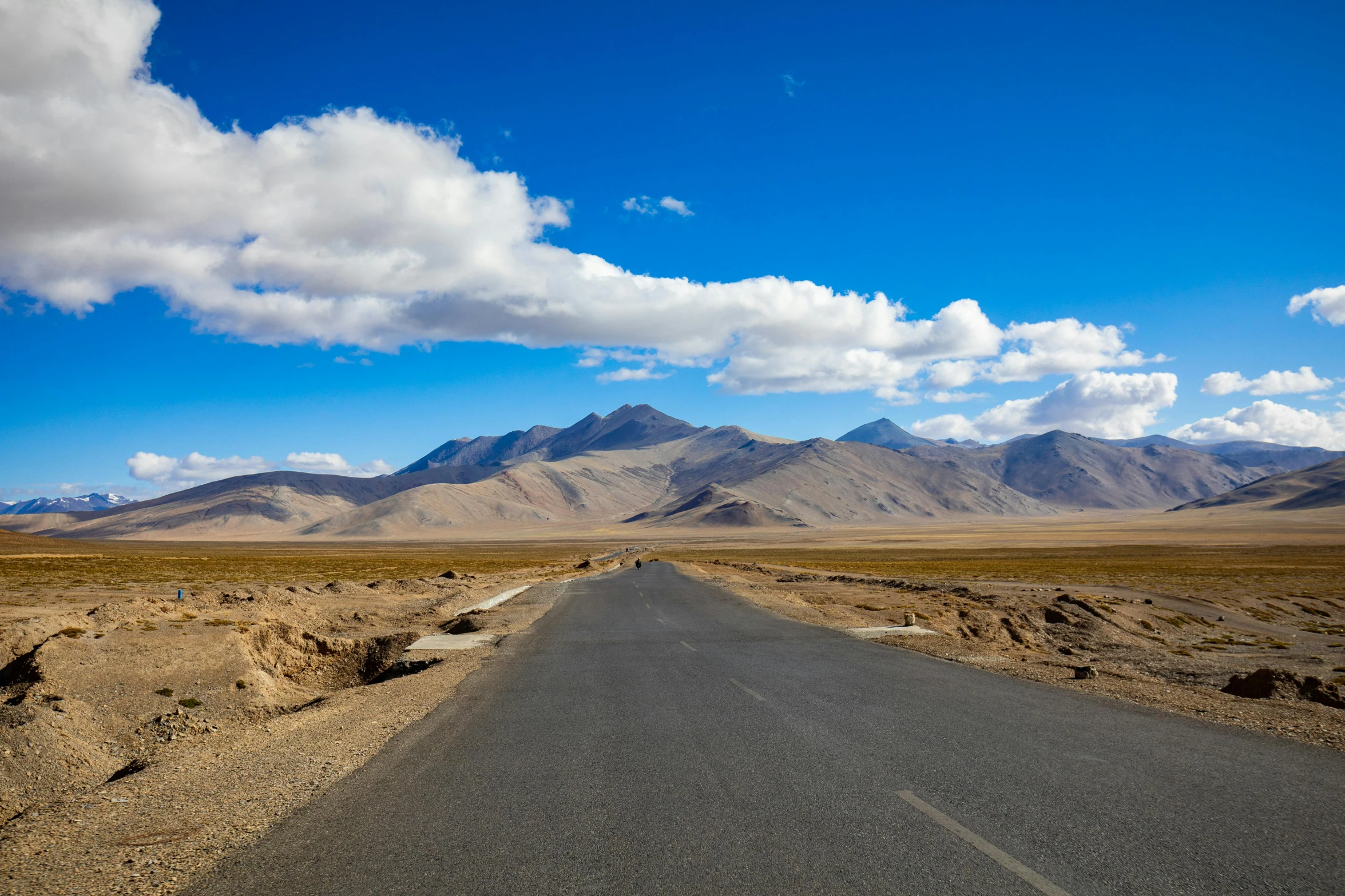 a long road in the middle of the desert