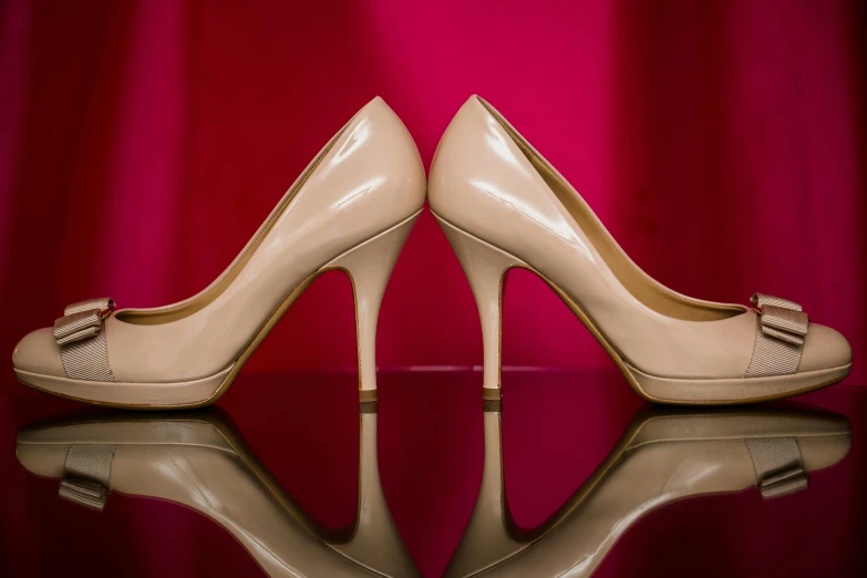 the reflection of a pair of high heel shoes