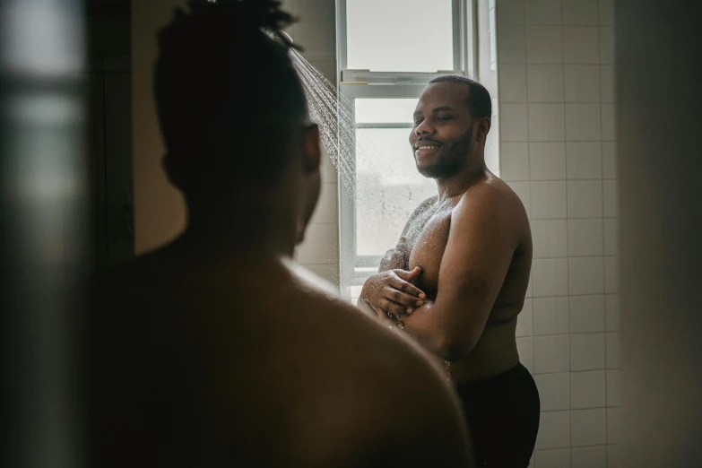 a man is taking a shower in the shower