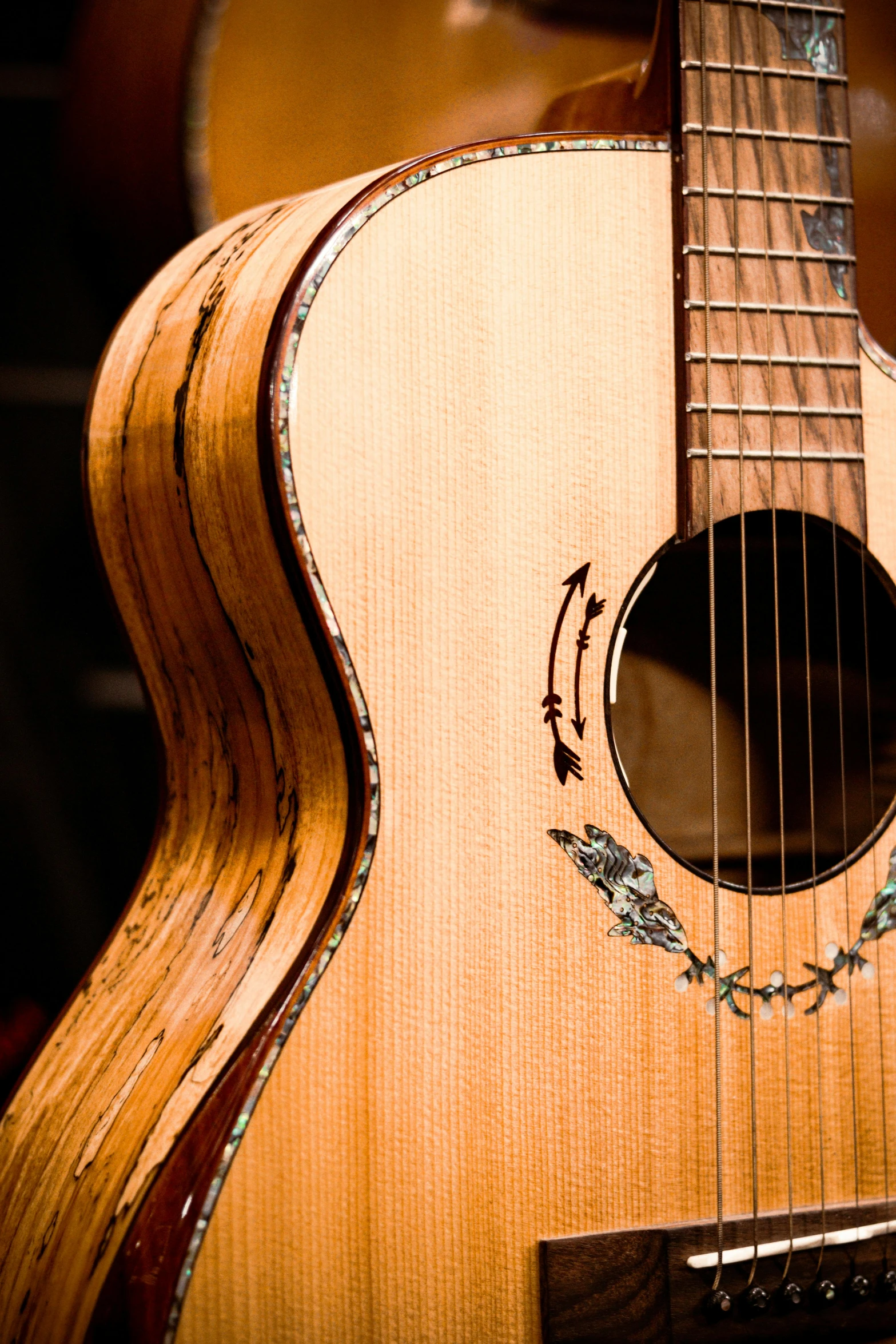 the wooden guitar has a string on it