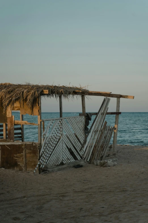 a boat with a cover on top in the beach