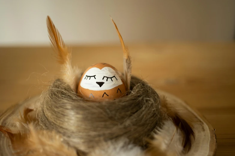 an egg with two eyes that are sitting on top of a wig