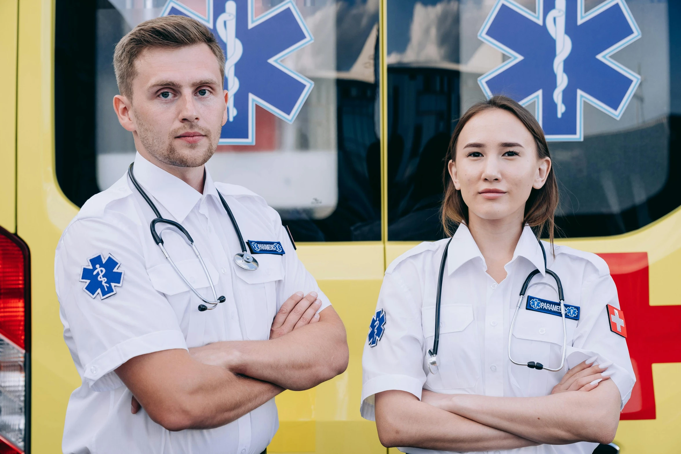 two doctors standing by the ambulance parked