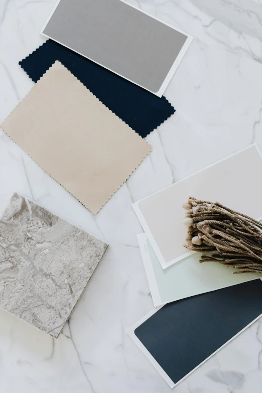 four different colors of paper laid out on a table