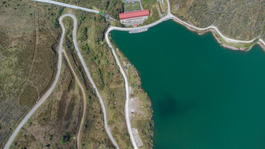 an aerial view of a lake surrounded by land