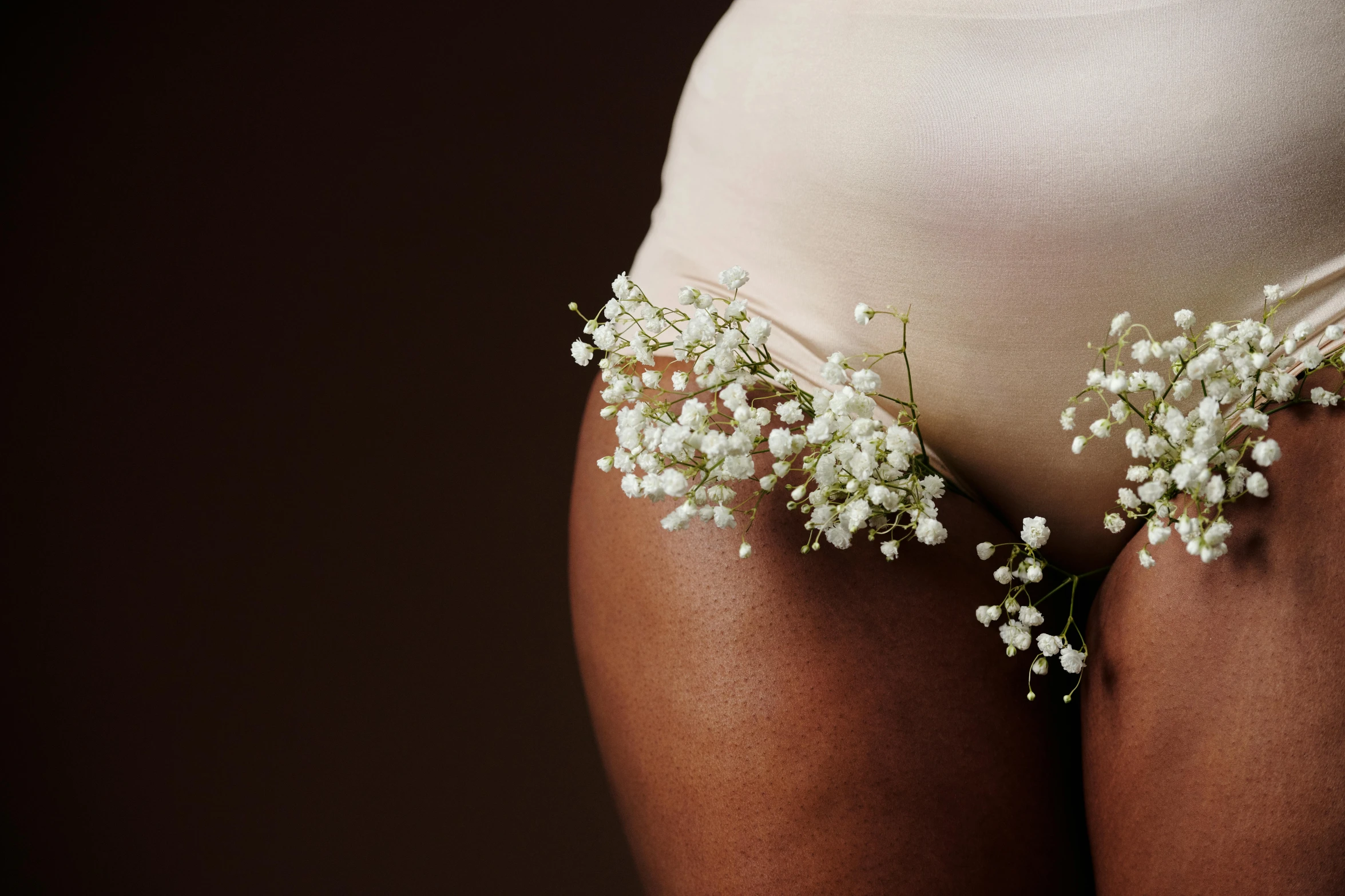 a womans panties is adorned with flowers