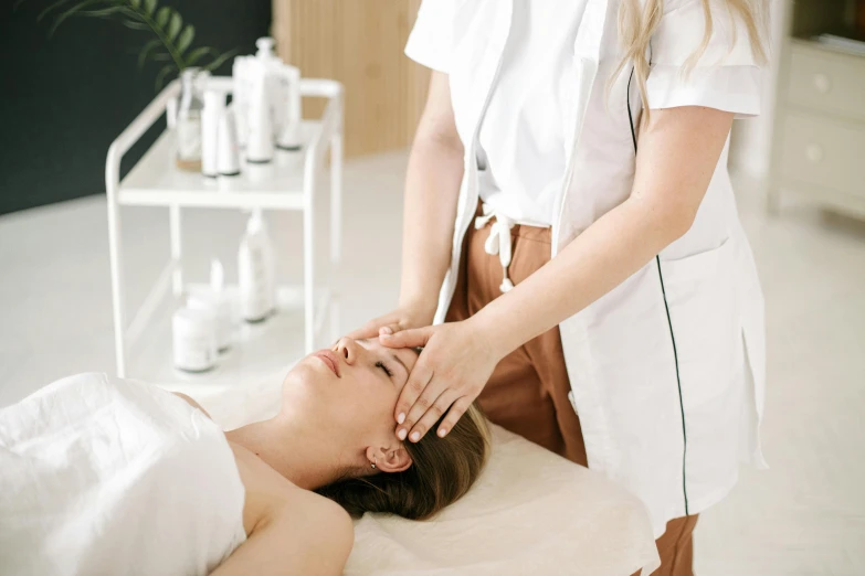 a woman getting her back massage at the spa