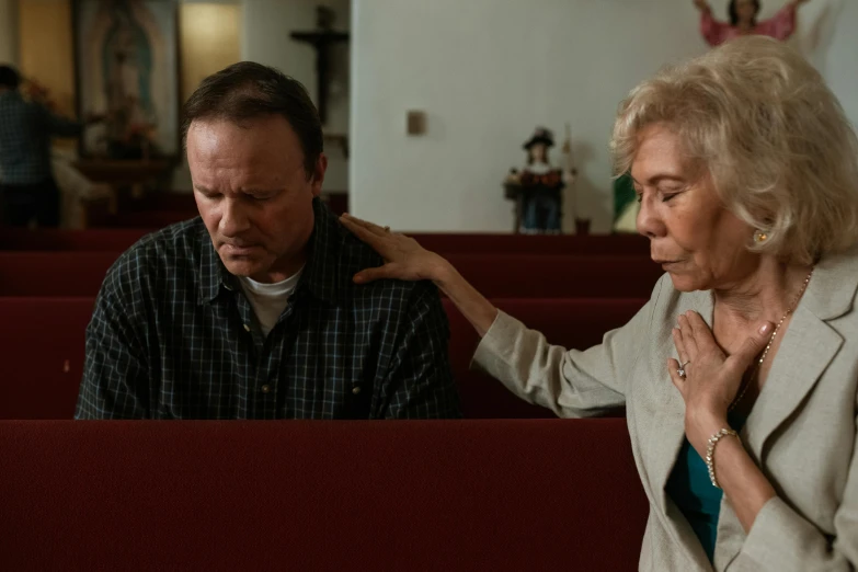 a woman standing next to a man in a church