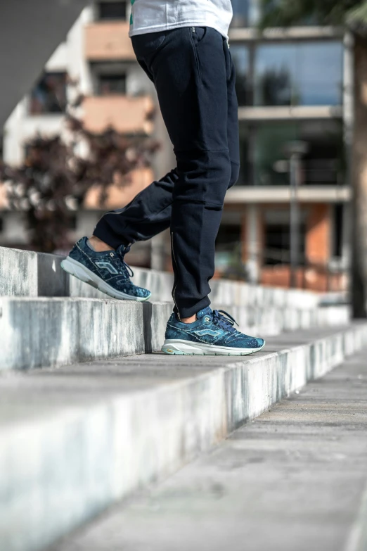 a person standing on some concrete steps near the water