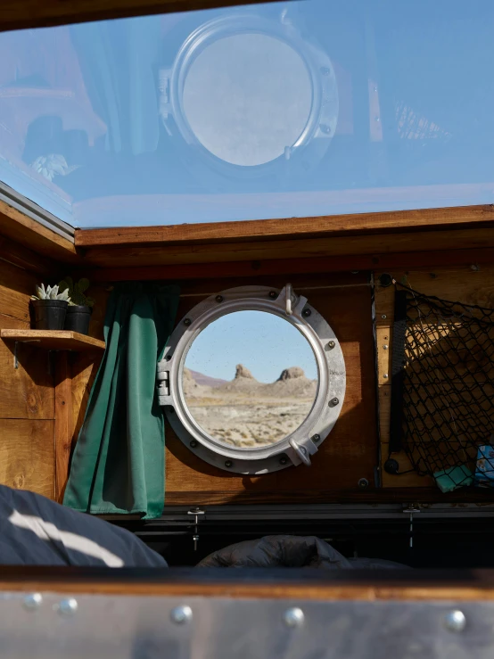a boat's view is reflected in the mirror