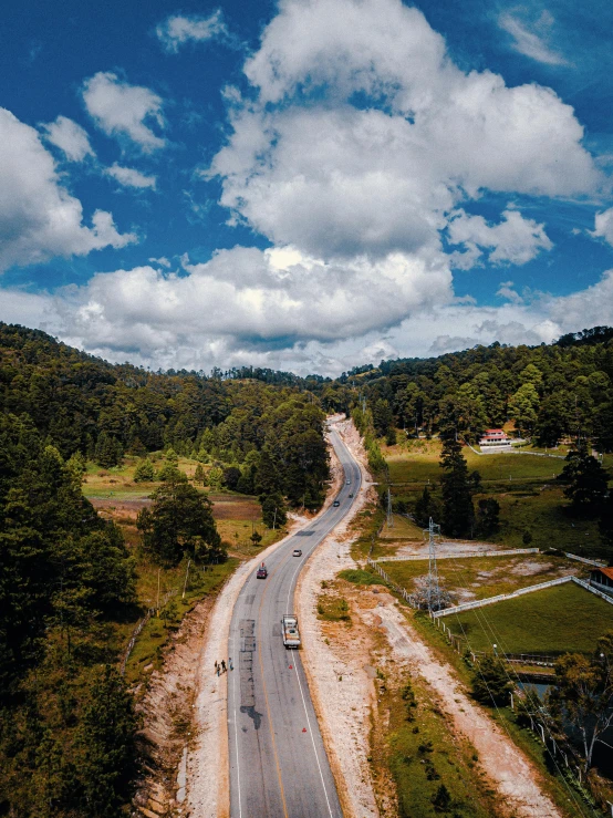 a long road and road in a forested area