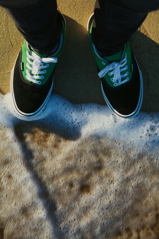 a person standing with shoes on in a park