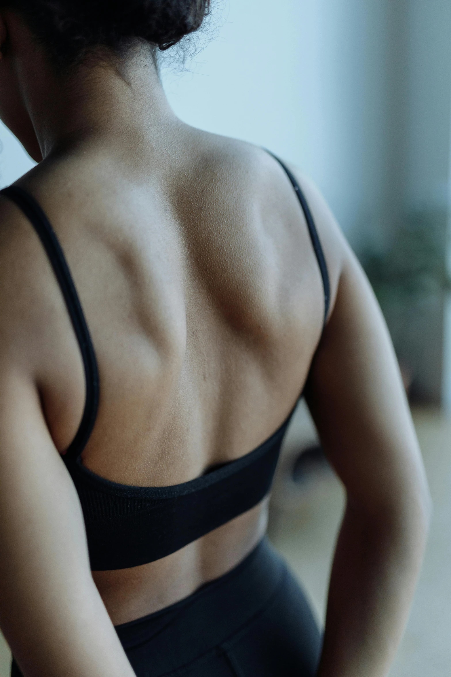 a woman standing with her back to the camera