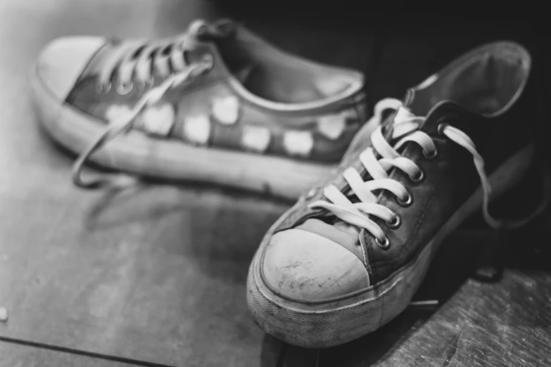 a pair of sneakers is displayed on the floor