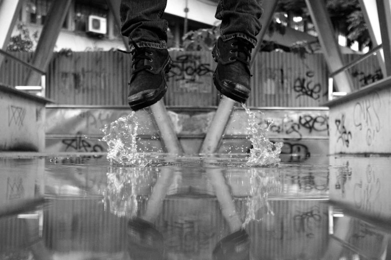 a skateboarder jumping over a dle into the air