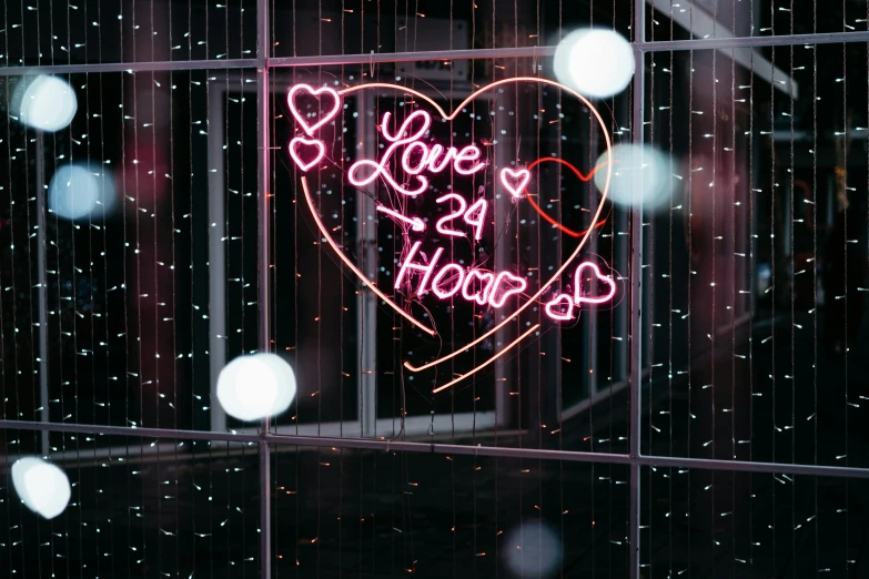 a lighted sign that says love is in the house