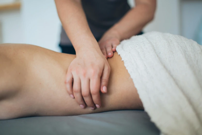 a woman having a back massage at the same time