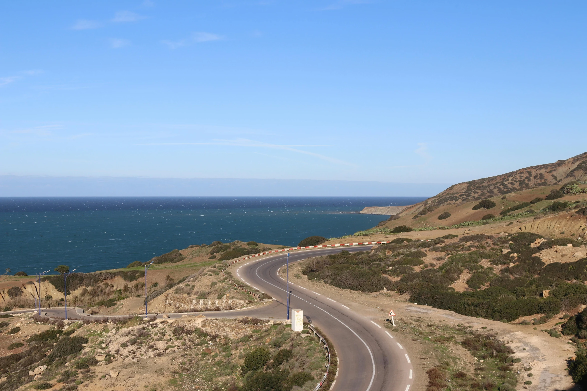 a view of a scenic road on the coast