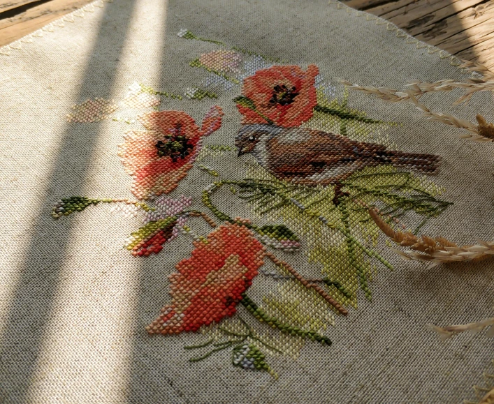 a floral art is on a table with an unfinished surface