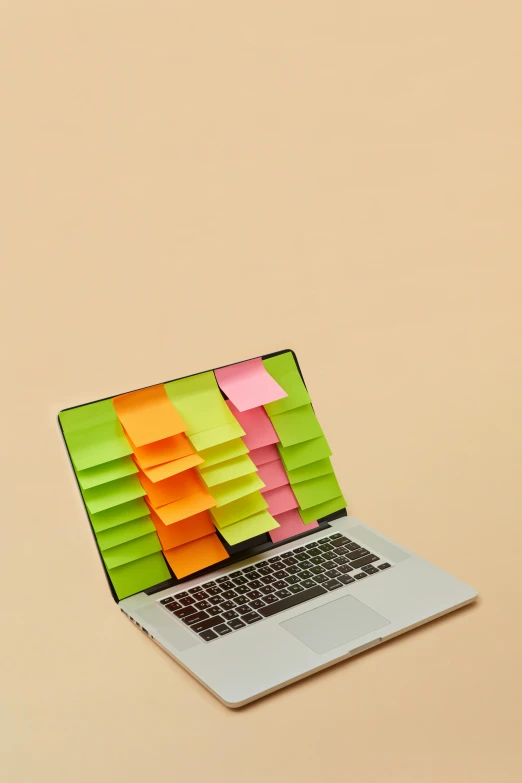 a laptop computer with colored strips on the keyboard