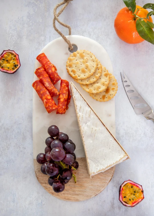 various ers, gs, sausage and cheese on a plate