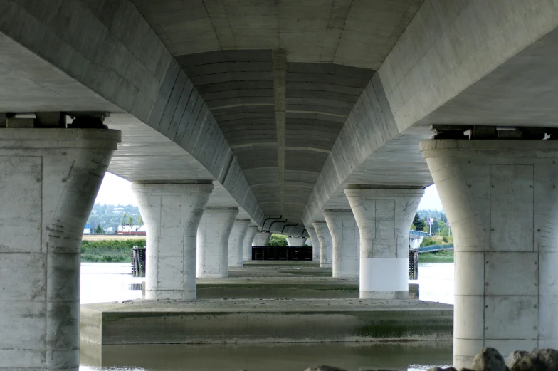 multiple cement arches with water under them