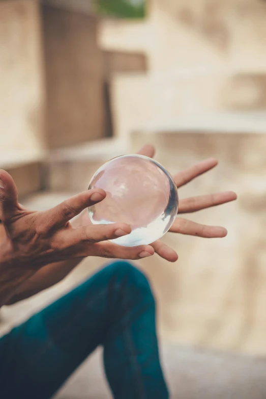 a hand that is about to drop a dish into it