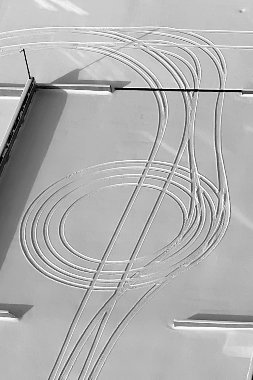 a wire connected to an extension board near two tracks