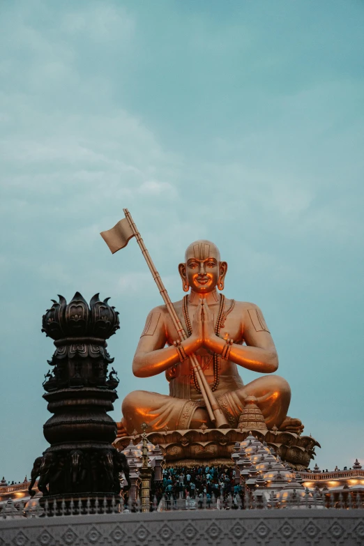 an outdoor statue with a flag sitting on top of it