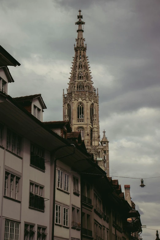 a city has a very tall tower with a clock