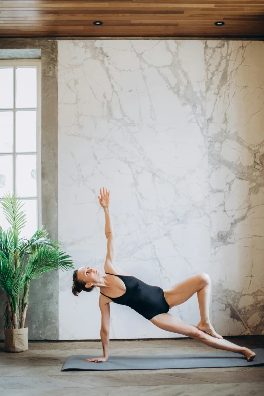 woman doing stretching exercises in a spacious room