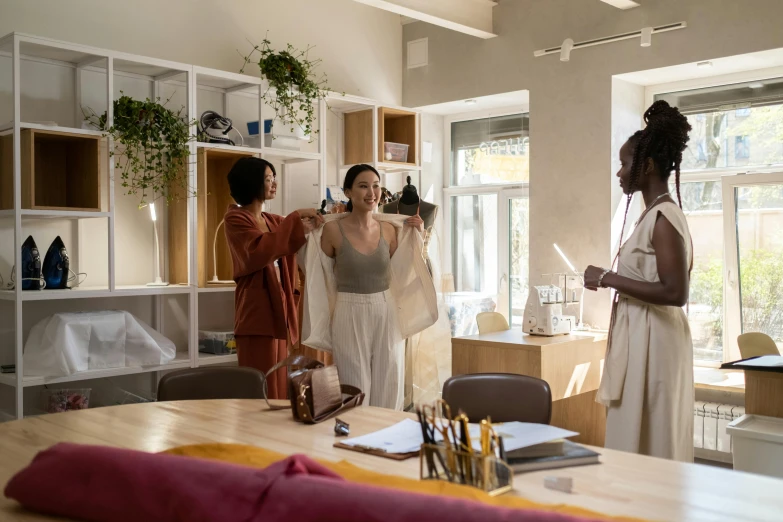 two women are trying to dress for a party