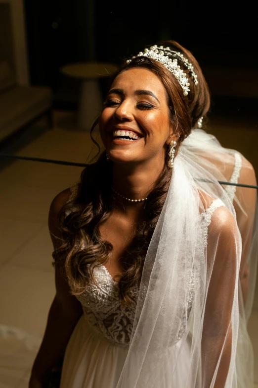 the bride smiles for her wedding pograph