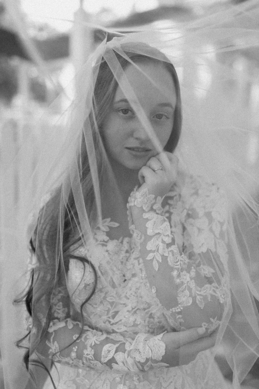 a woman looking down at her veil