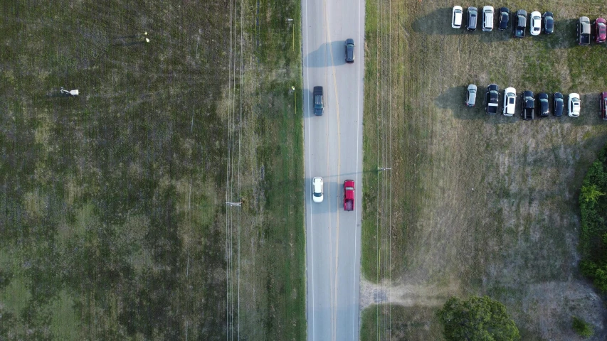 an aerial s of parked cars on a road