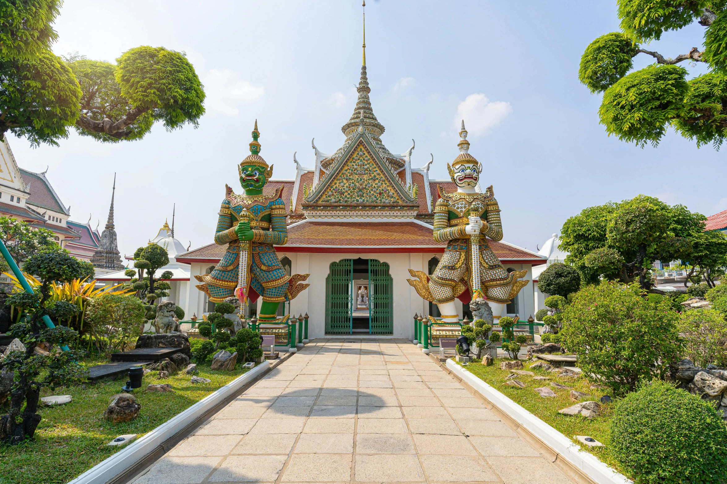 an elaborately decorated temple on top of a hill