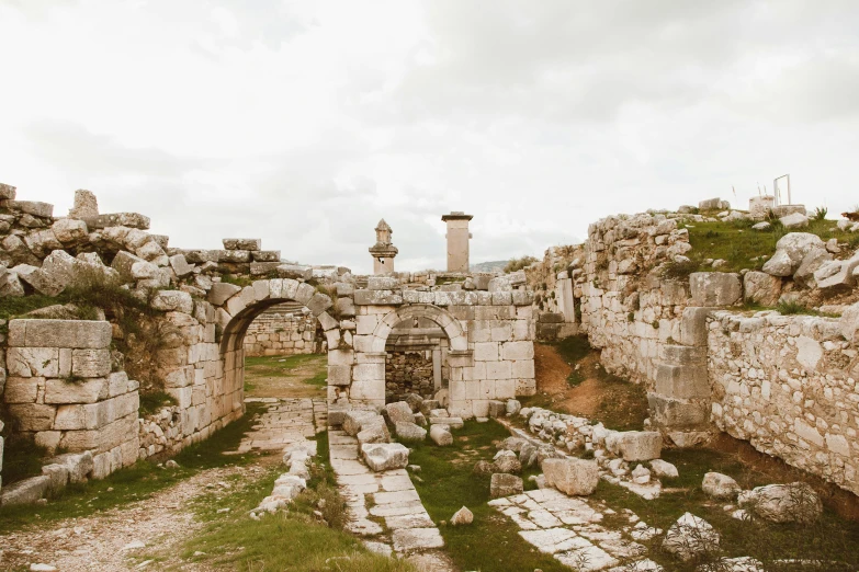 the ruins of an old roman town that have a stone archway