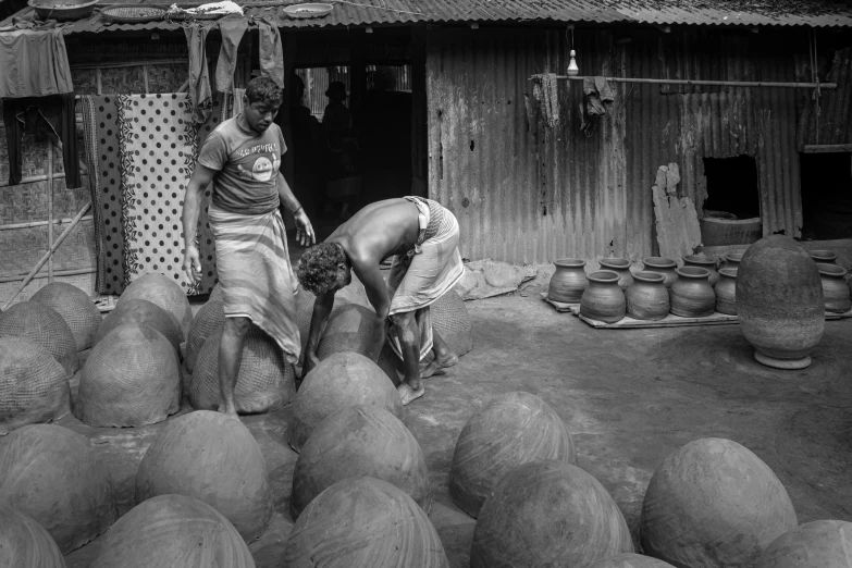 a woman is sitting on top of a pile of balls