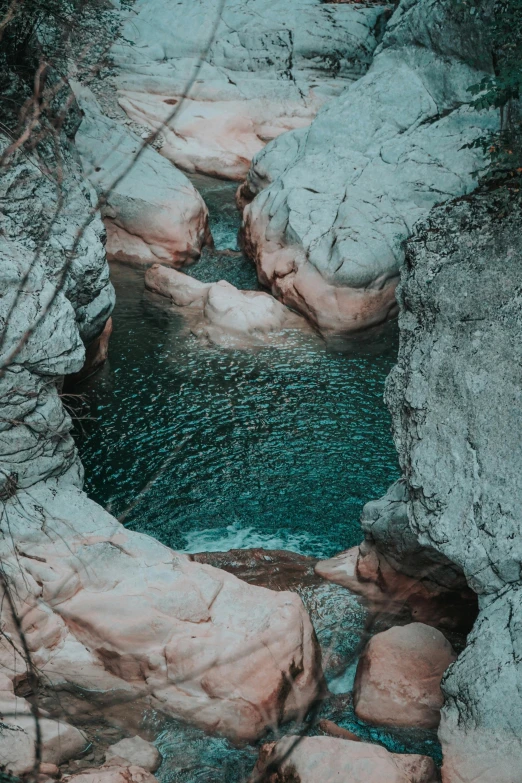 a very rocky river in a narrow canyon