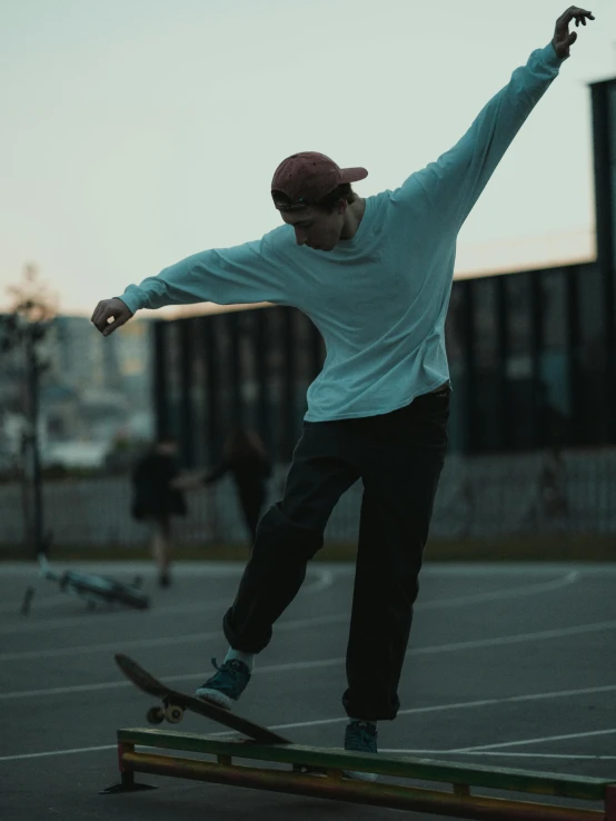 a young man riding his skateboard on top of a ramp