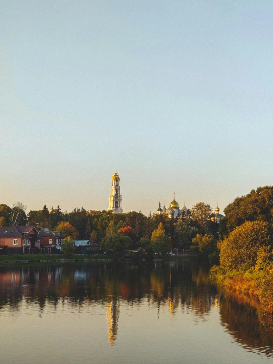 a city skyline as seen across a lake