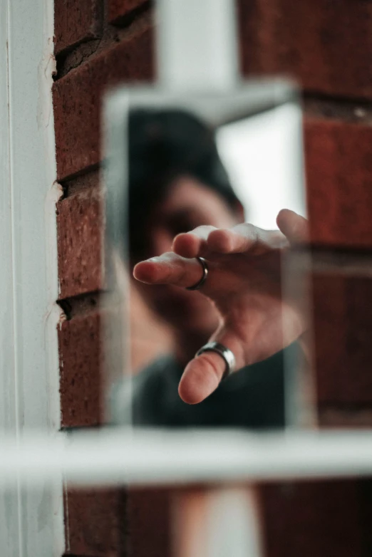 a person holding a cigarette in their left hand