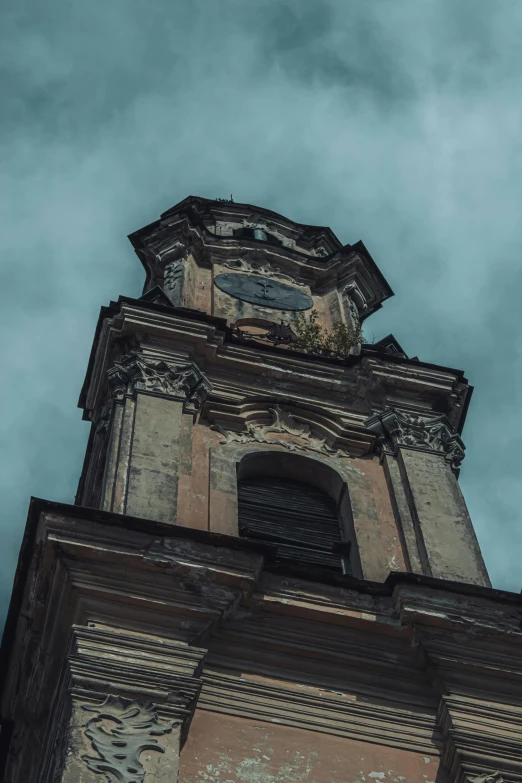 looking up at the top of an old brick building