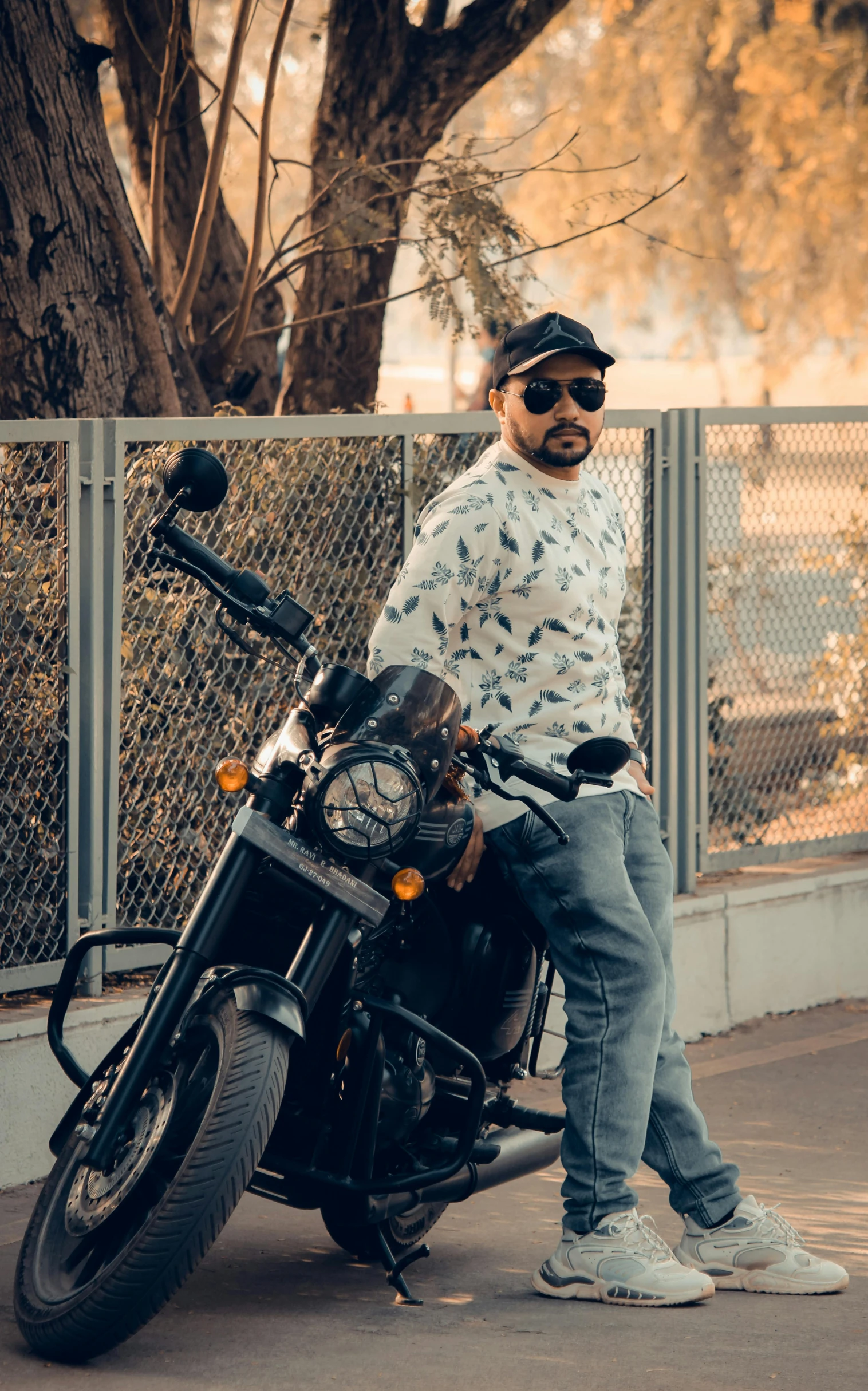 a man sitting on top of a motorcycle